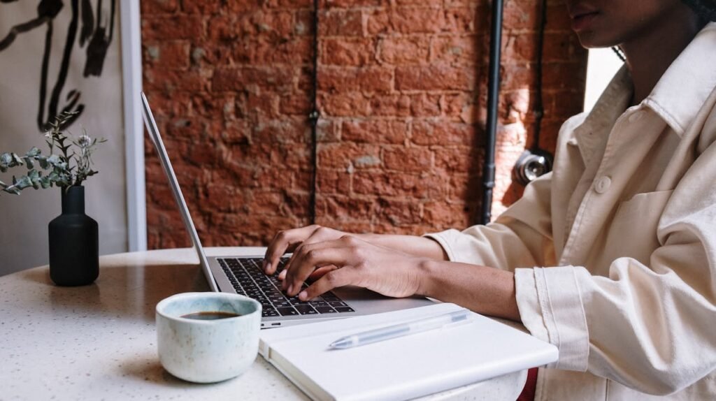 Blogger writing a lifestyle blog post on a laptop